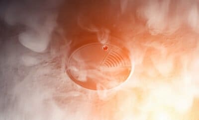 Ultimate Guide To Smoke Alarms 1 Photo Of A Smoke Detector With Smoke And Red Light To Depict Danger From Fire And The Importance Of Smoke Alarms That Work